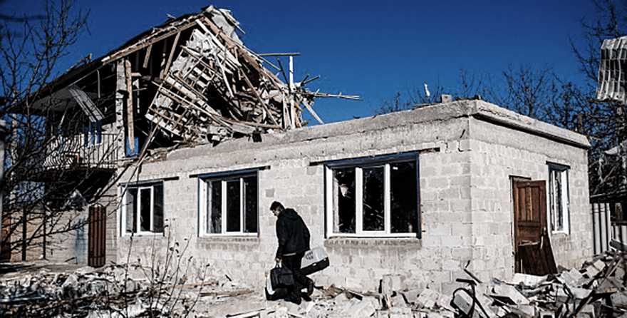 1415365268848_wps_15_A_man_carries_his_belongi